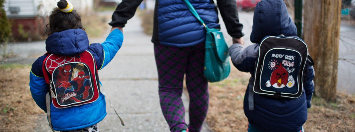 Mom and 2 kids walking 